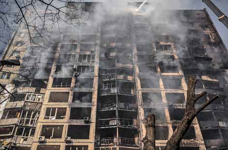 An image of a smouldering building in Kyiv.